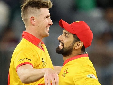Zimbabwe’s Bradley Evans and Sikandar Raza (right) celebrate during the ICC Men’s Twenty20 World Cup 2022 cricket match against Pakistan in Perth on October 27, 2022. 