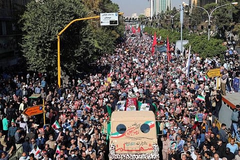 Mourners take part in a funeral for victims of a mass shooting at a key shrine earlier in the week that killed more than a dozen worshippers, in Iran's southern city of Shiraz, on October 29, 2022.  