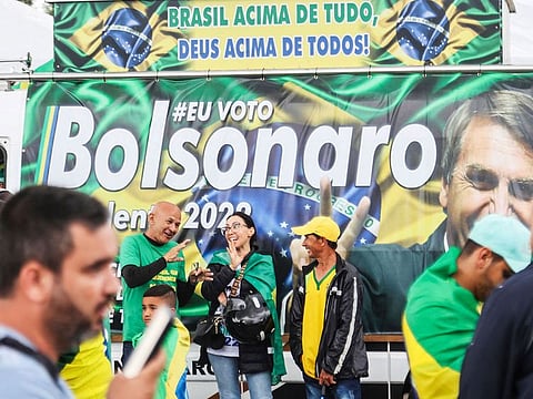 Supporters of President Jair Bolsonaro, mainly truck drivers, block the BR-101 highway in Palhoca, in the metropolitan region of Florianopolis, Santa Catarina State, Brazil, on October 31, 2022, as an apparent protest over Bolsonaro's defeat in the presidential run-off election.