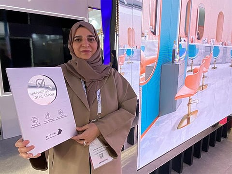 Dr Naseem Mohammed Rafee, director of the Health and Safety Department at Dubai Municipality, holds up an 'ideal salon' certificate.