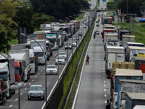 Supporters of Brazil's President Jair Bolsonaro block Presidente Dutra federal road during a protest against President-elect Luiz Inacio Lula da Silva who won a third term following the presidential election run-off, in Jacarei, Sao Paulo state, Brazil, November 1, 2022.