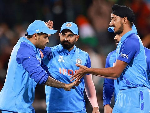 India’s Arshdeep Singh (right), Suryakumar Yadav (left) and Mohammad Shami celebrate after taking the wicket of Bangladesh’s Afif Hossain during the T20 World Cup cricket match at the Adelaide Oval on November 2, 2022. 