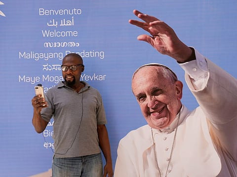 A Pope Francis portrait outside the Sacred Heart church in Manama, Bahrain, on November 2, 2022. 