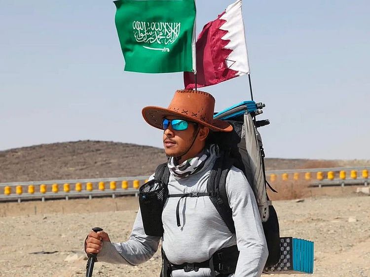 Saudi trekker Abdullah Alsulmi crosses a desert area near Al Khasrah area, some 350Km west of Riyadh, during his solo trek to the Qatari capital ahead of the FIFA World Cup.