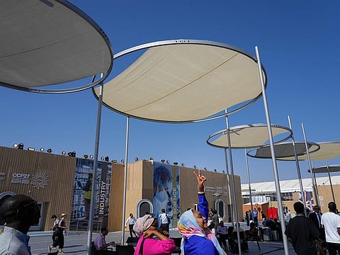 People mill about at the central plaza of the convention centre hosting the COP27 UN Climate Summit, on Saturday, November  5, 2022, in Sharm Al Sheikh, Egypt.  