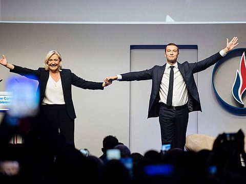 French far right leader Marine Le Pen celebrates with newly elected leader of the National Rally president Jordan Bardella during the party congress in Paris, Saturday, November 5, 2022. Jordan Bardella is the first party chief outside the Le Pen family in a half-century. 