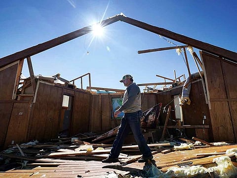 Danny Palmer, as deacon at Trinity Baptist Church, walks across the destroyed church's sanctuary while looking for items to salvage after a tornado hit in Idabel, Oklahoma, on Saturday, November 5, 2022. 