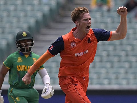 Netherlands' Fred Klaassen (right) celebrates the wicket of South Africa's Quinton de Kock during the ICC men's Twenty20 World Cup 2022 cricket match between Netherlands and South Africa at Adelaide Oval. The Netherlands won by 13 runs and the result means India have qualified for the semi-finals. 