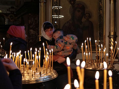 Ukrainian Orthodox faithful attend the Sunday mass at St Volodymyr's Cathedral in Kyiv, Ukraine.