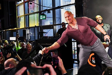 US actor Dwayne Johnson speaks onstage at the "Black Adam" Rocks Canada fan event.