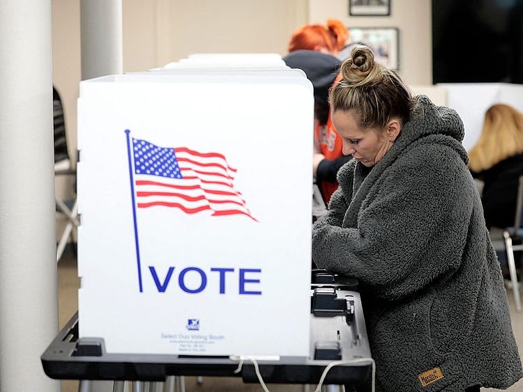 People cast their ballots in the US midterm election at Wolverine Lake, Michigan, on November 8, 2022.  
