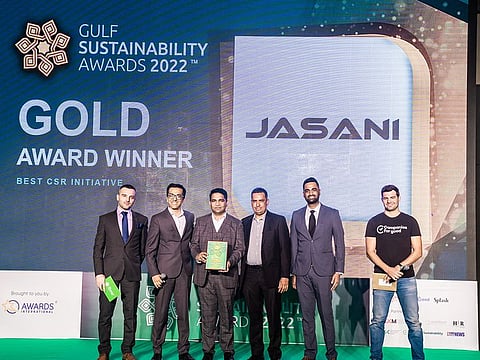 Awards Host Alexandr Ilic, the Jasani LLC team with Shrey Jasani, Javid Shaik, Ishan Hannan, Vinit Mehta, and Awards Judge and Founder of Companies for Good Marc Cirera