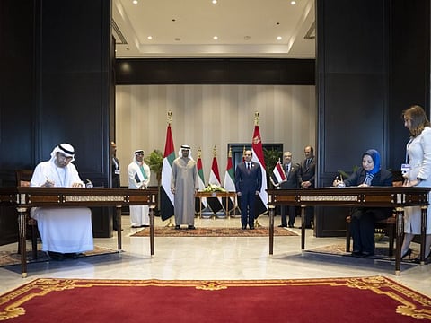 Sheikh Mohamed bin Zayed Al Nahyan and Abdul Fattah Al Sisi witness the signing of an MOU between the UAE and Egypt pertaining to the 10-gigawatt onshore wind project in Egypt, during the COP27 climate conference at the Sharm Al Sheikh International Convention Centre. 