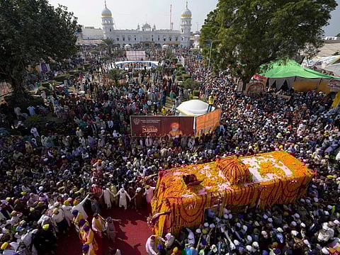 Sikh pilgrims attend a religious ceremony to celebrate the birth anniversary of their spiritual leader Baba Guru Nanak Dev, at Nankana Sahib, near Lahore on November 8, 2022.  