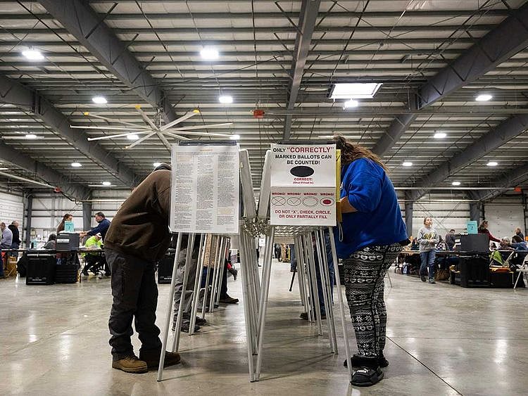 Voters fill out their ballots at the Flathead County