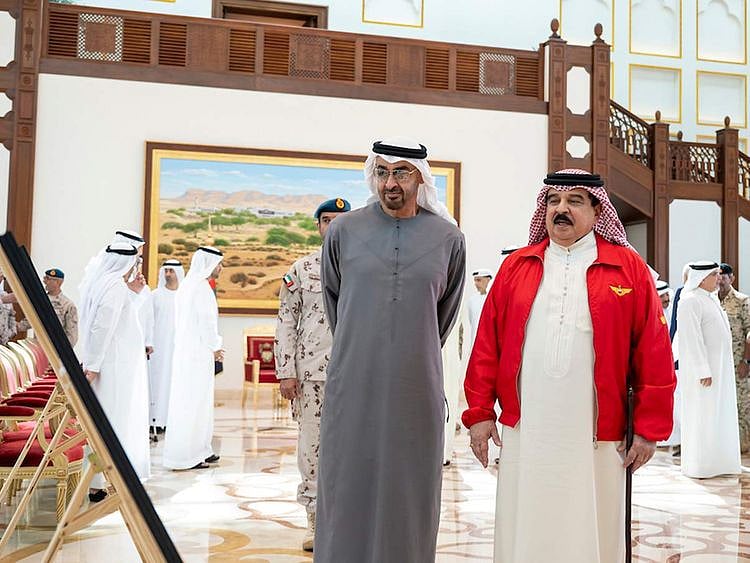 His Highness Sheikh Mohamed bin Zayed Al Nahyan, President of the United Arab Emirates with King Hamad bin Isa Al Khalifa look at photographs upon arriving at Sakhir Air Base, Bahrain.