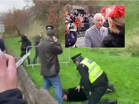 Several police officers could be seen grappling with a man at a crowd barrier. Britain's PA news agency reported that the protester booed and shouted "This country was built on the blood of slaves" as he was being detained.