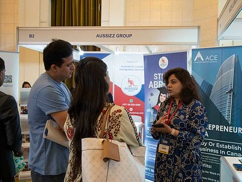 Visitors exploring immigration opportunities at GNICE 2022