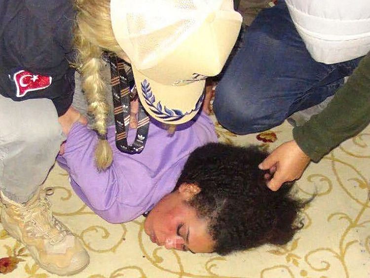  Police detaining the suspect.