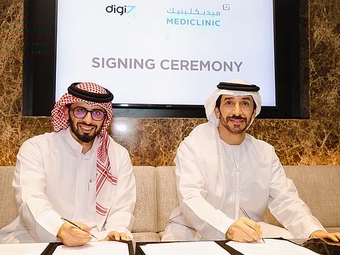   Ahmed Al Haj, Founder and CEO of Digi7, and Ahmed Ali, Executive Director of  Mediclinic Middle East, sign the agreement