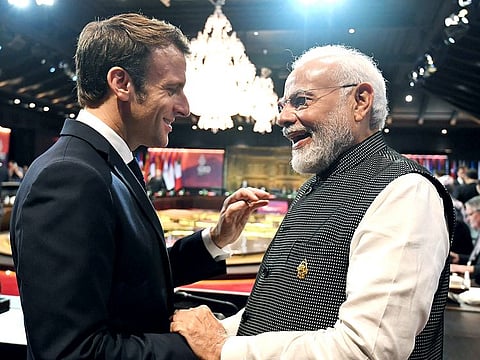 Prime Minister Narendra Modi exchanges greetings with French President Emmanuel Macron at the 17th G20 Summit, in Bali. 