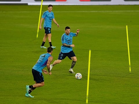 Argentina's Lionel Messi (middle) plays with his teammates during a training session ahead of their friendly against UAE in Abu Dhabi.