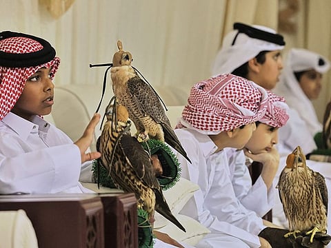 Contestants with their falcons during a junior falconry competition in Ras Laffan, some 80km north of Doha. 