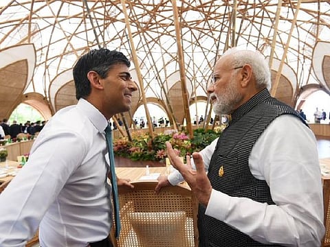 Indian Prime Minister Narendra Modi and British Prime Minister Rishi Sunak in conversation during the first day of the G20 Summit in Bali.