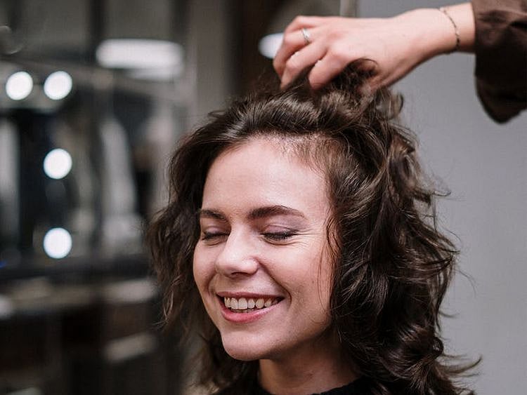 Woman styling her hair