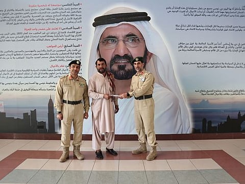 Dubai Police honouring Pakistani expat Abbas Khan. 
