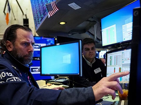 Traders work on the floor of the New York Stock Exchange (NYSE) in New York City, U.S., November 15, 2022.  