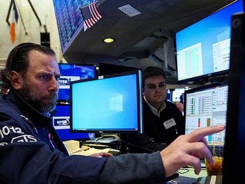 Traders work on the floor of the New York Stock Exchange (NYSE) in New York City, U.S., November 15, 2022.  