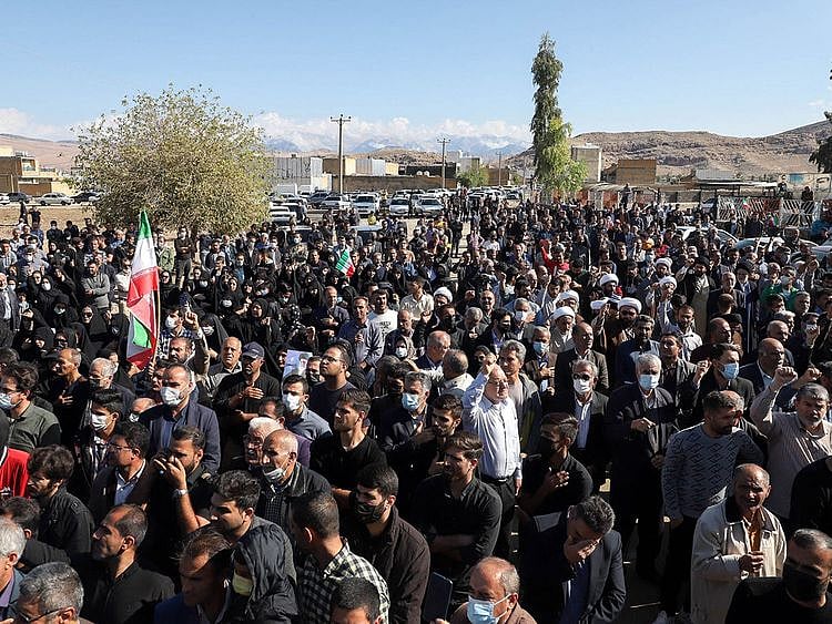 Iranians at the funeral procession of people killed in a shooting attack, in the city of Izeh in Iran's Khuzestan province, on November 18, 2022.  