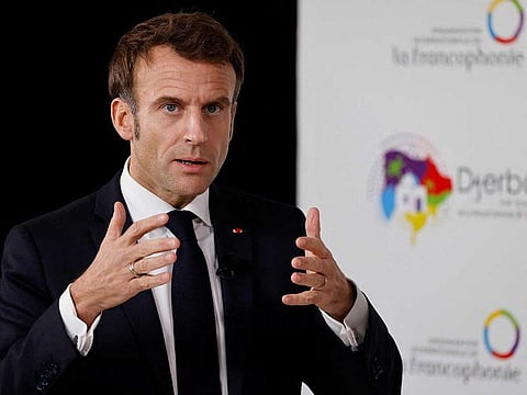 France's President Emmanuel Macron speaks to the press during a bilateral meeting at the 18th Francophone countries Summit in Djerba, on November 19, 2022.  