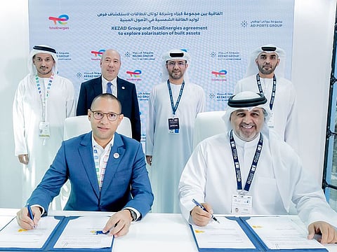 Officials from AD Ports Group and TotalEnergies during the agreement signing between KEZAD Group and TotalEnergies Renewables Distributed Generation Middle East & Africa.
