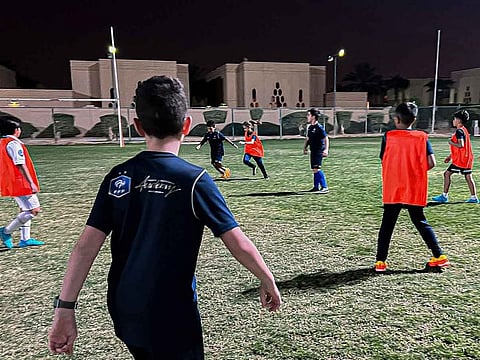 Young football players train at the Ishbilia compound, one of the locations of the French Football Federation Academy, in the Saudi capital Riyadh, on November 13, 2022. Youth football academies in Saudi Arabia expect a spike in registrations during the World Cup in neighbouring Qatar, and say investment in training facilities must pick up to serve the coming wave. 
