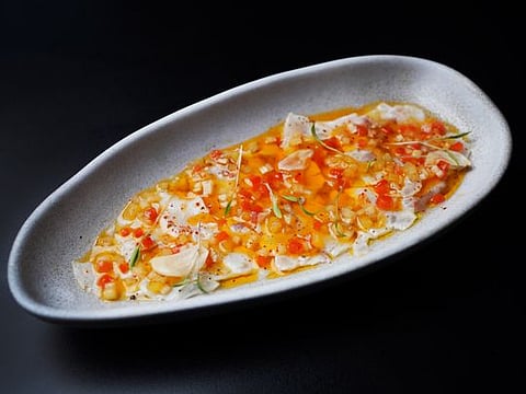 Sea bass crudo with confit vegetable escabèche