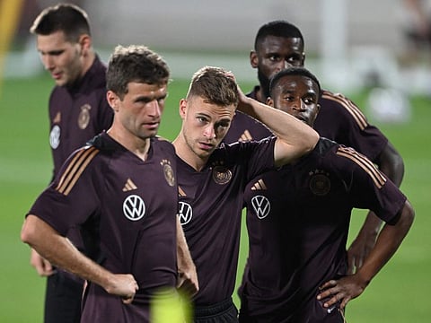 (From left to right): Germanys Thomas Mueller, Joshua Kimmich and Youssoufa Moukoko attend a training session at Al Shamal Stadium in Al Shamal, north of Doha.