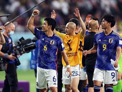 Japan's Wataru Endo, Daizen Maeda, Kaoru Mitoma celebrate after beating Germany 2-1 in the Group E World Cup clash at the Khalifa International Stadium, Doha, Qatar.