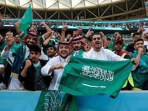 Supporters celebrate Saudi Arabia’s victory over Argentina in the Qatar 2022 World Cup Group C football match the Lusail Stadium, north of Doha, Qatar, on November 22, 2022. The 2-1 win will rank as one of the biggest upsets in World Cup history. 