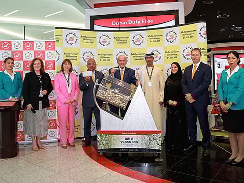 Dubai Duty Free representatives with the million-dollar ticket 