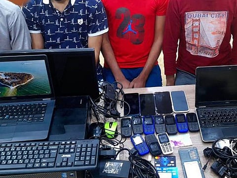 Some of the seizures made from the residential apartment from where the fraudsters operated in Sharjah. 