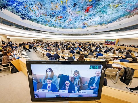 A monitor shows Khadijeh Karimi, deputy of the vice president for Women and Family Affairs in Iran, as she adresses the assembly during a special session of the UN Human Rights Council on the situation in Iran, at the United Nations in Geneva on November 24, 2022.  