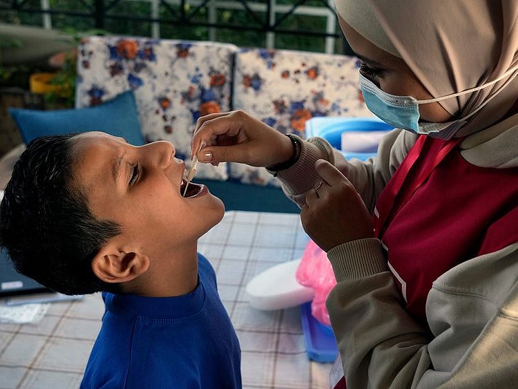 A boy receives cholera vaccine in Lebanon which recently reported its first cholera case.