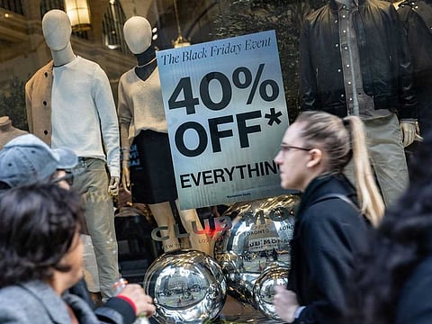 A Black Friday sale sign outside a Club Monaco store on Black Friday in New York, US, on Friday, Nov. 25, 2022. US retailers are bracing for a slower-than-normal Black Friday as high inflation and sagging consumer sentiment erode Americans demand for material goods. 