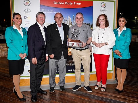 Dermot Davitt receiving his trophy from Colm McLoughlin, Executive Vice Chairman & CEO, along with Sinead El Sibai, SVP - Marketing and Des Smyth, golf professional