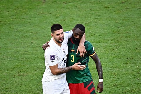Well played... Cameroon's defender Nicolas Nkoulou (right) hugs Serbia's forward Aleksandar Mitrovic at the end of the Qatar 2022 World Cup Group G match at the Al-Janoub Stadium in Al-Wakrah, south of Doha. The match ended in a thrilling 3-3 draw.