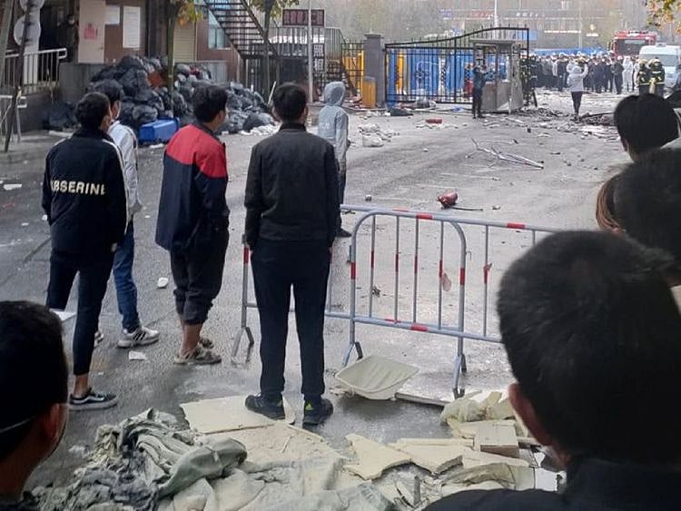 Workers at the world's biggest Apple iPhone factory in central China
