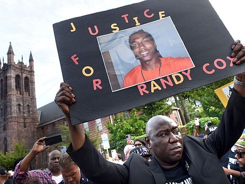 Civil rights attorney Benjamin Crump takes part in a march for Justice for Richard "Randy" Cox from the Stetson Library to the New Haven Police Department on July 8, 2022, in New Haven, Conn.