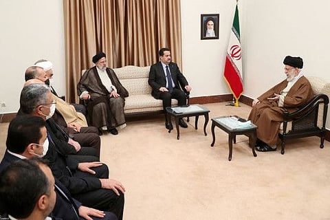 This handout picture provided by the office of Iran's Supreme Leader Ayatollah Ali Khamenei shows him and President Ebrahim Raisi meeting with Iraq's Prime Minister Mohammad Shia Al Sudani (2nd right) in Tehran on November 29, 2022.  